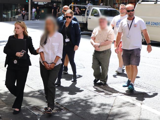 Police arrest William Costellia-Kamm and Sandra Costellia in Sydney on Monday. Photo: NSW Police