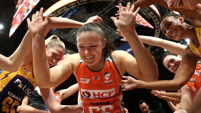 Giants star Susan Pettitt, who retired after the match, runs through a guard of honour. Picture: Getty Images