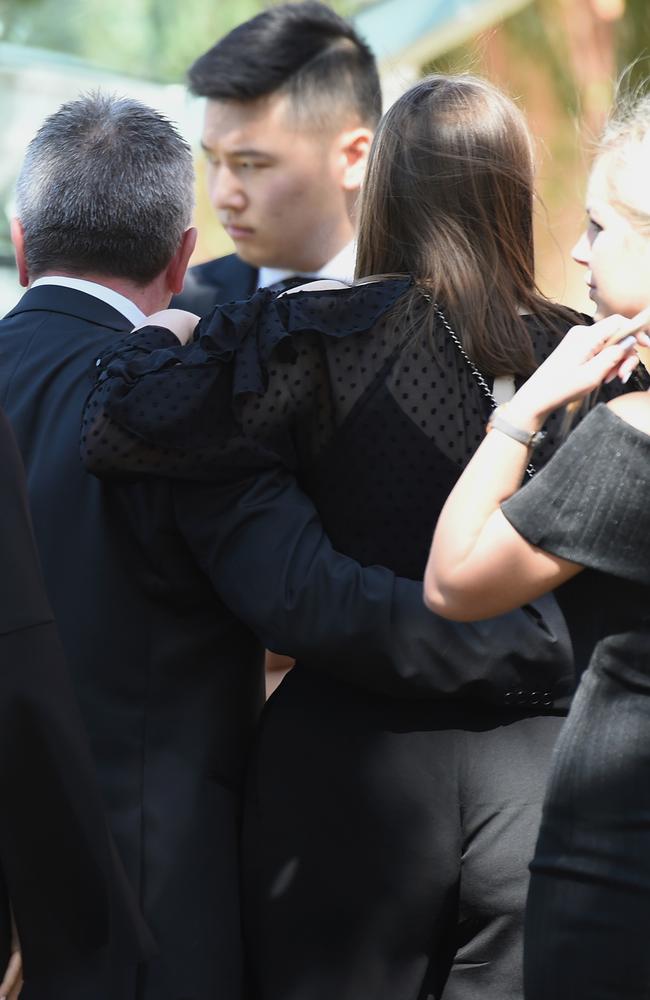 Borce Ristevski and his daughter, Sarah, arm in arm after the service. Picture: Nicole Garmston