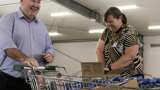 Bundaberg Mayor Jack Dempsey was one of dozens of volunteers pushing a trolley loaded with boxes for this year's most vulnerable.