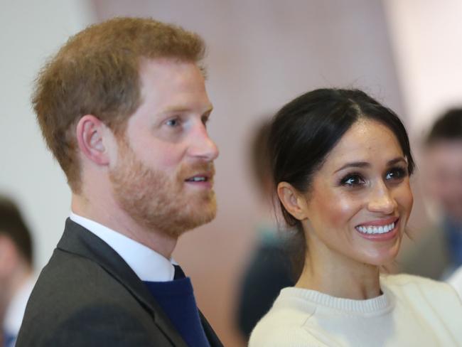 Prince Harry and Meghan Markle speak with staff during a visit to Northern Ireland’s next generation science park, Catalyst Inc. in Belfast last month/ Picture: AFP