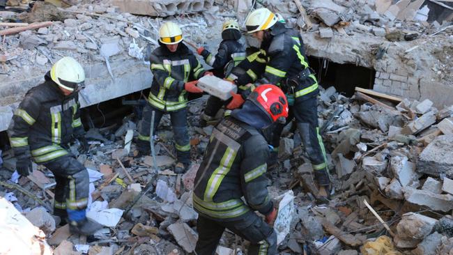 Rescuers conducting search operations and dismantling debris in Kharkiv. Picture: AFP