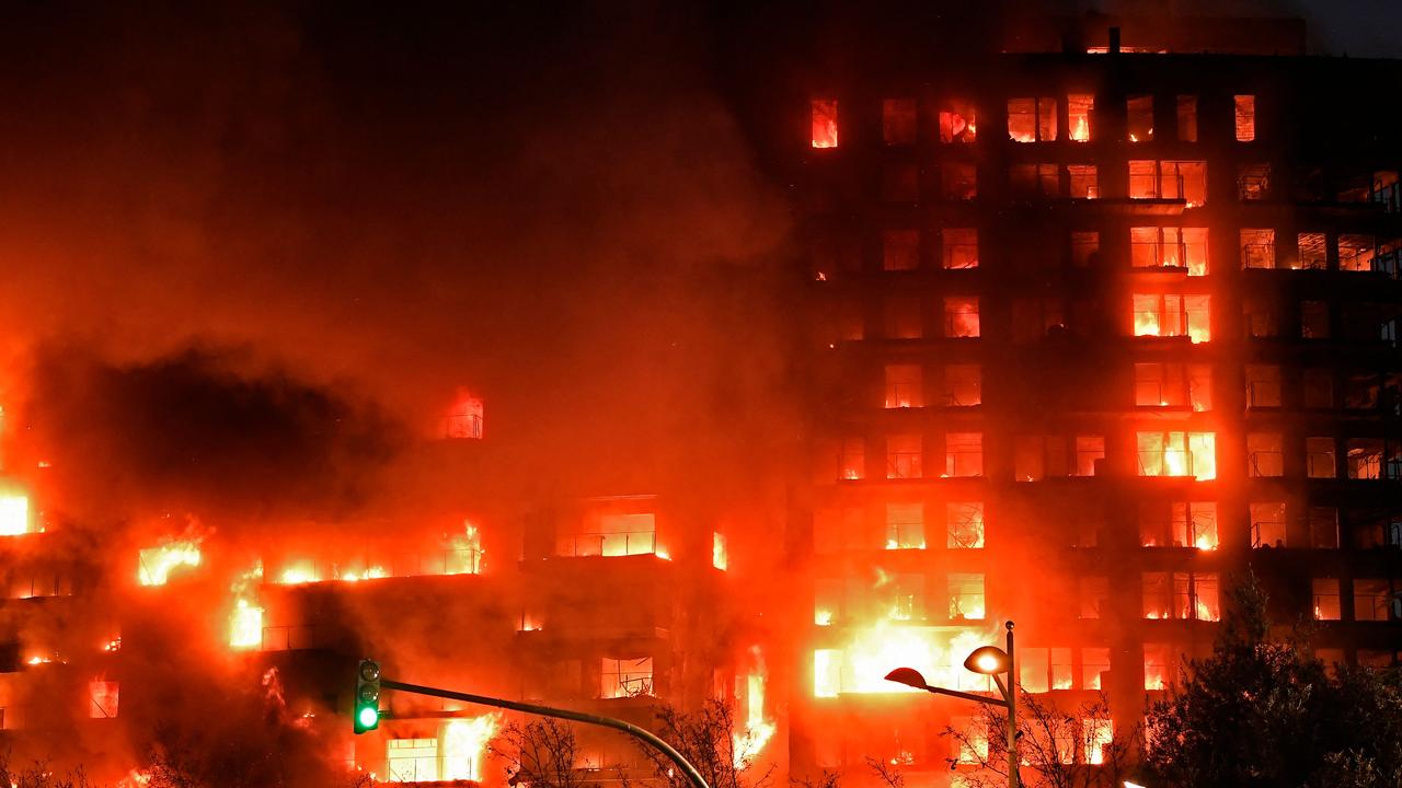 A huge fire rages through a multistorey residential block in Valencia on February 22, 2024 (Photo by Jose Jordan / AFP)