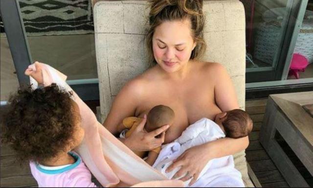 Chrissy Teigen hits back at troll who shamed her for breastfeeding snap