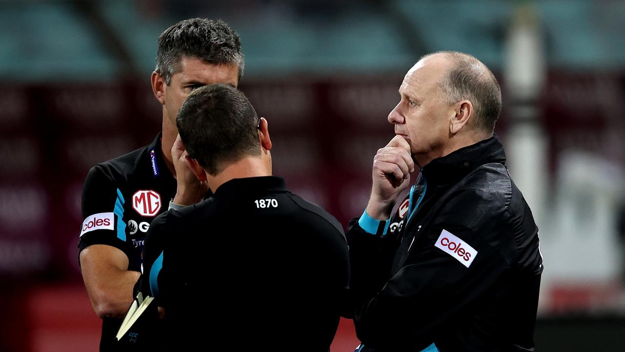 Hinkley with assistants Nathan Bassett and Josh Carr during the win over Sydney. Picture: Brendon Thorne/AFL Photos