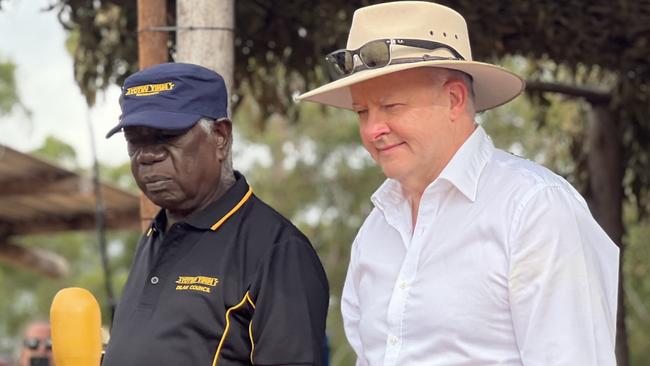 Garma Festival 2024, Gulkula, East Arnhem NT. Chairman of the Yothu Yindi Foundation Djawa Yunupingu and Prime Minister Anthony Albanese watch on as Yolngu people perform traditional dance on the Bunggul grounds for the official opening ceremony of Garma Festival. Picture: Fia Walsh.