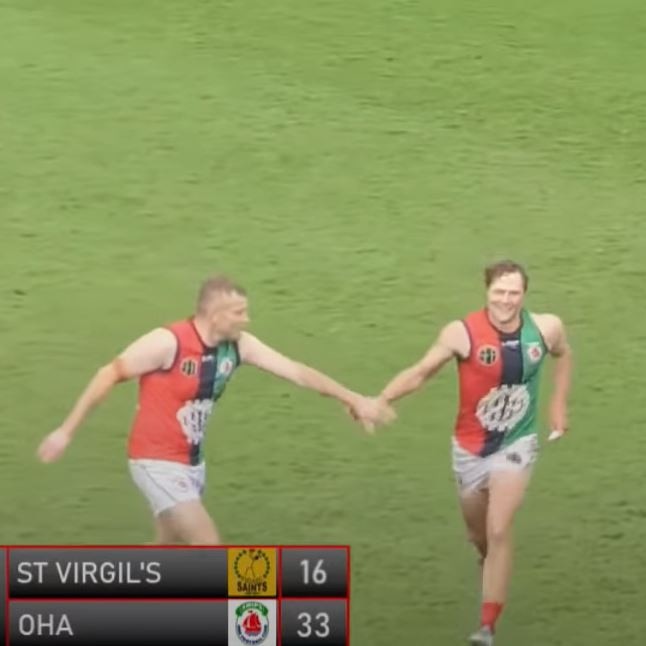 OHA player Ray Hill high-fives a teammate after being sent off in the St Virgil's V OHA Old Scholars Grand Final after star St Virgils player Jaye Bowden was left concussed. Picture: DUFFTV