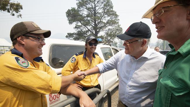 Prime Minister Scott Morrison meets with NSW Rural Fire Service volunteers at Ilford/Running Stream. (AAP Image/Wolter Peeters, SMH Pool)