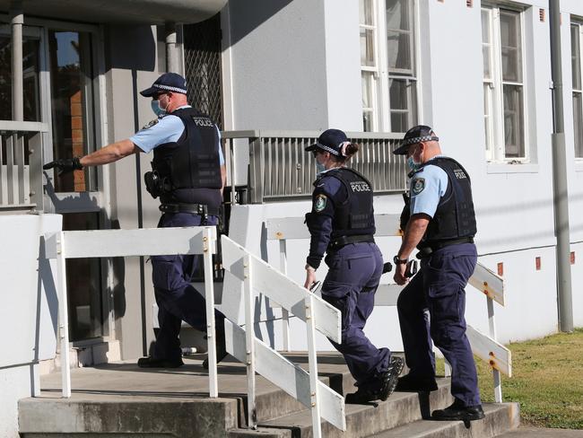 Police interview neighbors. The scene at apartments blocks in Darby Street, Newcastle, where a man was fatally shot in the chest.Picture by Peter Lorimer