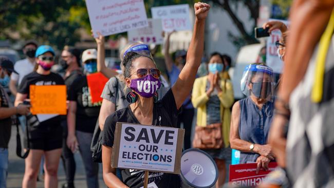 Protesters hold a ‘Save the Post Office’ demonstration outside a US Postal Service location in Los Angeles on Saturday. Picture: AFP