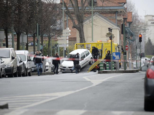 A car belived to be have been used by an attacker who shot dead the female police is loaded onto the back of a truck in the suburban town of Arceuil. Picture: Eric Feferberg