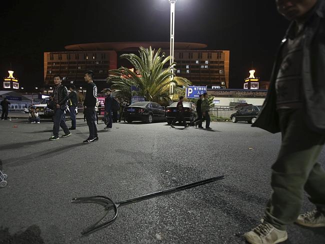 A fork ... used by the police to handle attackers is left on the ground outside a railway station after an attack by knife wielding men in Kunming. Picture: AP
