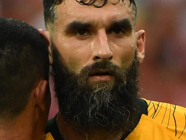 Australia's Mile Jedinak and Tim Cahill after their loss to Peru during their final FIFA World Cup group match at Fisht Stadium during the FIFA 2018 World Cup in Sochi, Russia, Tuesday, June 26, 2018. (AAP Image/Dean Lewins) NO ARCHIVING