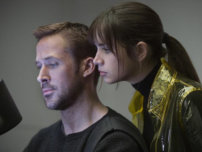This image released by Warner Bros. Pictures shows Ryan Gosling, left, and Ana de Armas in a scene from 