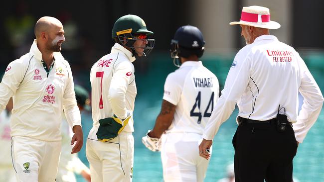 Australian captain Tim Paine (second from left) and off spinner Nathan Lyon (left) question umpire Paul Wilson (right) over a DRS call that didn’t go the hosts’ way. Picture: Getty Images