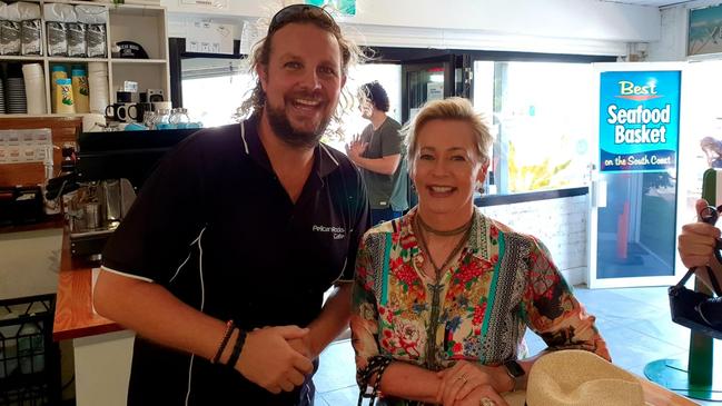 Award-winning Pelican Rocks Cafe owner Sam Cardow with keen customer Amanda Keller.