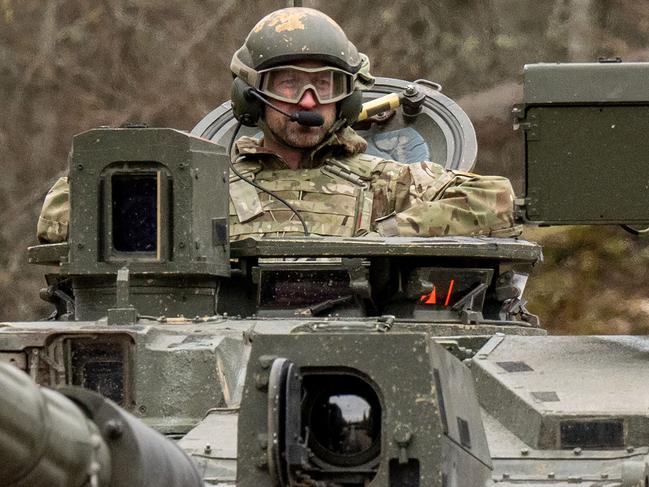 Prince William, Prince of Wales rides in a Challenger 2 tank while visiting British service personnel at the Tapa Army Base, northern Estonia. Picture: AFP