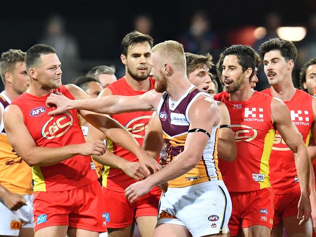 Players clash after Steven May’s big hit on Stefan Martin during a QClash.