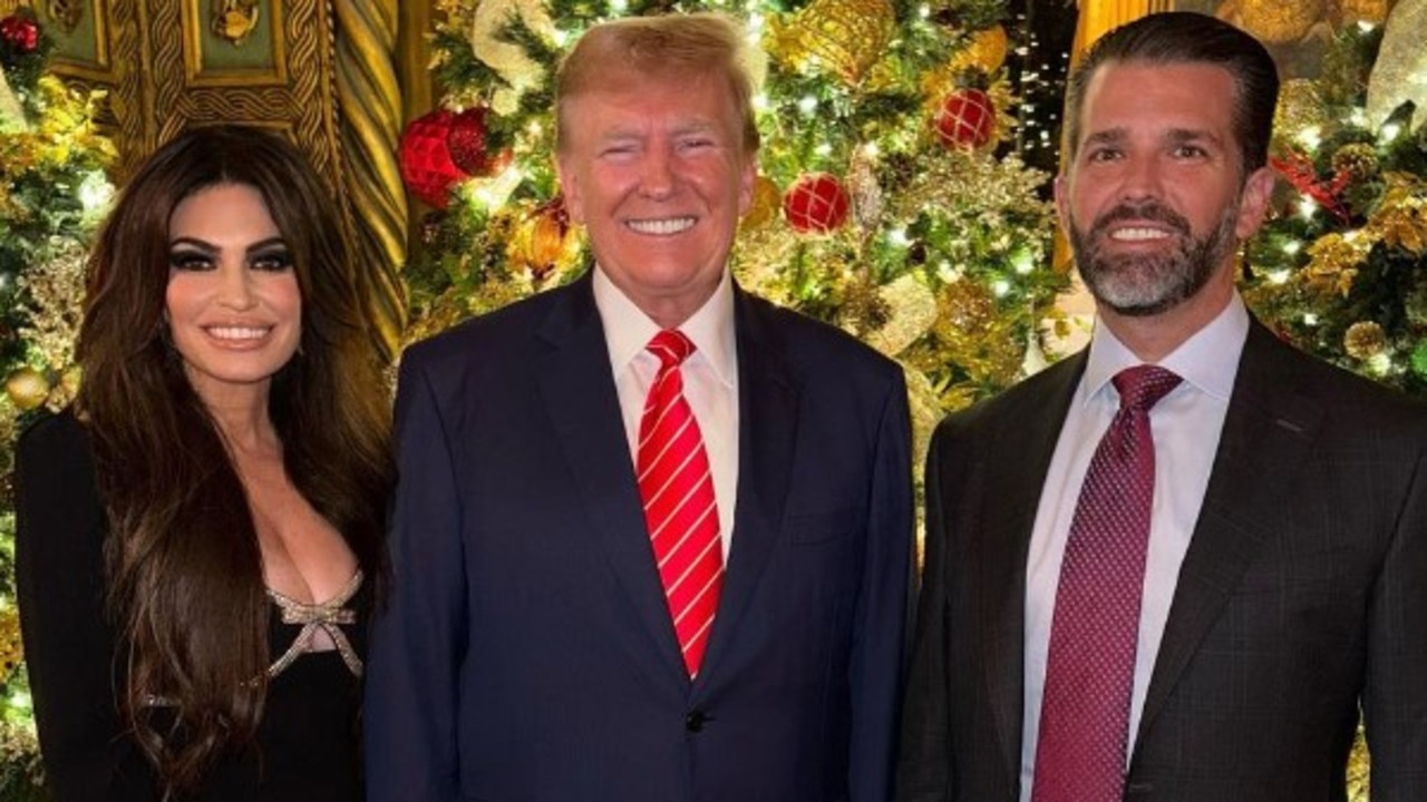 Donald Trump Jr and his fiancee Kimberly standing with Donald Trump (Picture: Instagram/kimberlyguilfoyle)