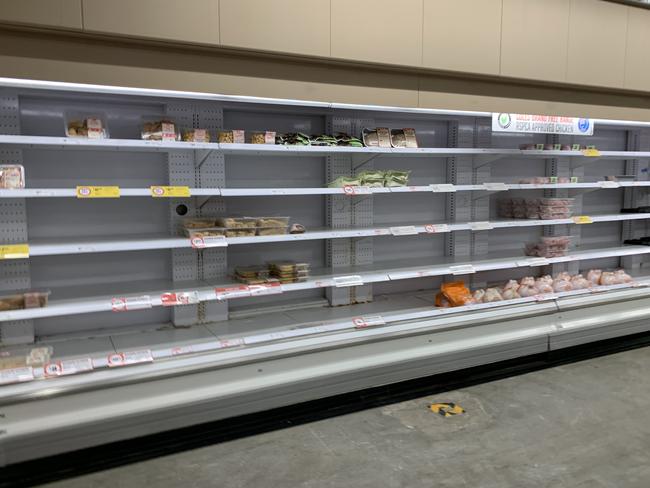 Empty shelves as stores are cleared out. Picture: Ian Currie