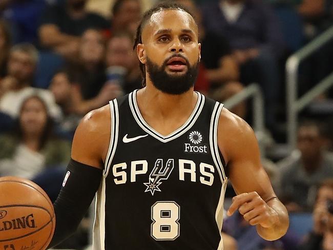 ORLANDO, FL - OCTOBER 12: Patty Mills #8 of the San Antonio Spurs looks to make a pass during a pre-season game against the Orlando Magic at Amway Center on October 12, 2018 in Orlando, Florida. NOTE TO USER: User expressly acknowledges and agrees that, by downloading and or using this photograph, User is consenting to the terms and conditions of the Getty Images License Agreement.   Sam Greenwood/Getty Images/AFP == FOR NEWSPAPERS, INTERNET, TELCOS & TELEVISION USE ONLY ==