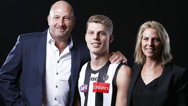 Father Craig Kelly with son Will and wife Meredith Kelly.