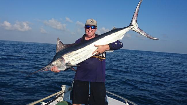 Lucky angler Ben Judd with his black marlin, landed after a 40 minute fight.