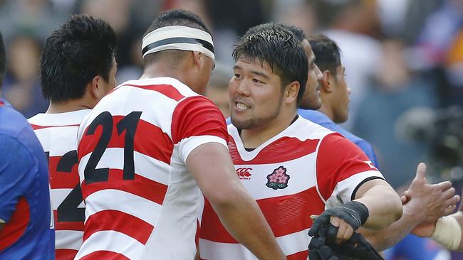 Japan's Hendrik Tui and Masataka Mikami celebrate after the game.