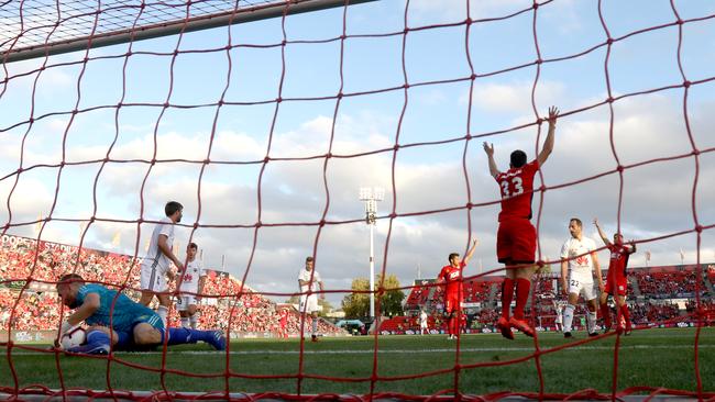 Wellington Phoenix gloveman Filip Kurto cannot stop Adelaide United’s Apostolos Stamatelopoulos’ header from crossing the line in a 3-1 win for the Reds. (Photo by Kelly Barnes/Getty Images)