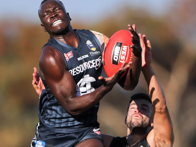 18/6/16 SANFL South Adelaide v Port Adelaide at Hickinbotham Oval. Picture by Matt Turner. Irra Emmanuel of South marks over Jimmy Toumpas of Port.