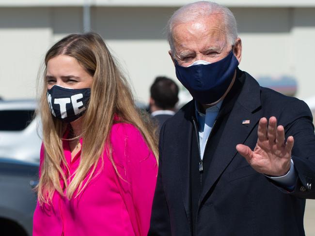 Joe Biden’s granddaughter Finnegan, left, with the presidential nominee. Picture: AFP