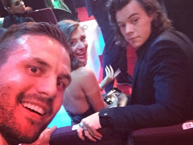 Beau Ryan posts, “Sitting behind some guy called #HarryStyles from @onedirection #Arias.”