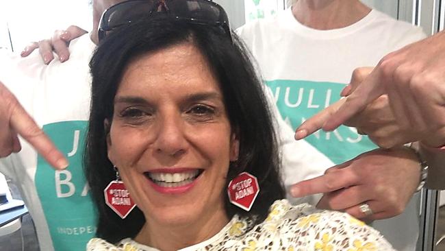 Liberal defector Julia Banks poses in her #Stop Adani earrings. 