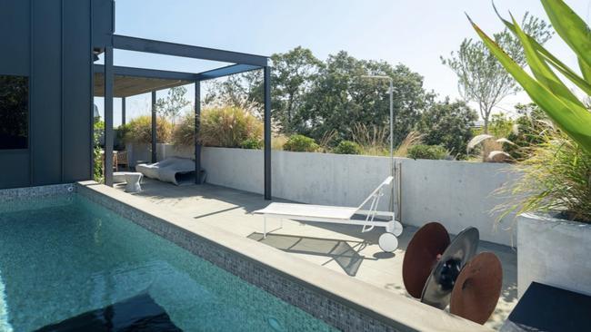 There is a glass-bottomed heated pool with swim jet on the rooftop terrace. Picture: realestate.com.au