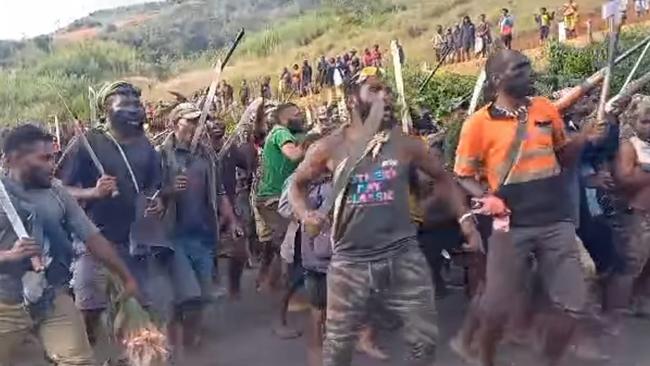 Tribal fighters in Papua New Guinea's Enga Province show their strength, with many armed with machetes. Picture: Facebook