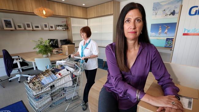 Perth-based Global Travel Solutions agent Jo -Anne Francis empties out her office with the help of her colleague, Karen Way. Picture: Colin Murty