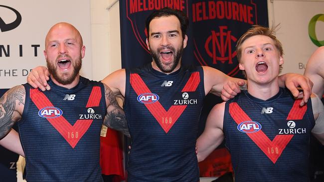 Nathan Jones, Jordan Lewis and Charlie Spargo celebrate Melbourne’s finals win. Picture: Getty Images