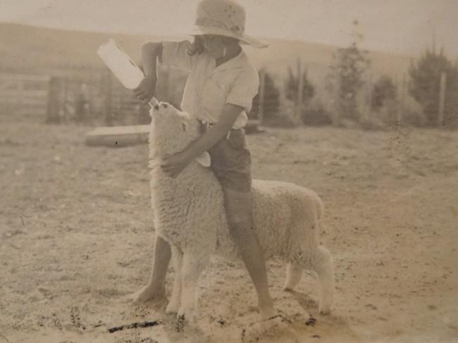 Memories: Bunny Mortimer feeding a lamb when she was about eight years old.