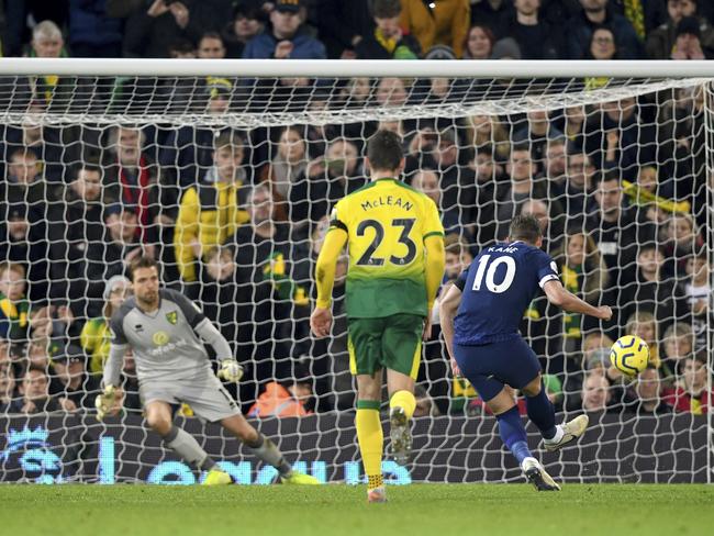 Tottenham Hotspur's Harry Kane, right, scores against Norwich City's Alexander Tettey during the English Premier League soccer match at Carrow Road, Norwich, England, Saturday Dec. 28, 2019. (Joe Giddens/PA via AP)