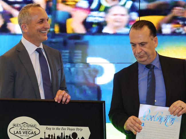 LAS VEGAS, NEVADA - FEBRUARY 26: (L-R) National Rugby League CEO Andrew Abdo and Chairman of the Australian Rugby League Commission Peter V'landys are presented with a ceremonial key to the Las Vegas Strip from Clark County (NV) Commissioner Chairman Tick Segerblom during the NRL Las Vegas media launch at the Rugby League Fan Hub at Resorts World Las Vegas on February 26, 2025 in Las Vegas, Nevada.   Ethan Miller/Getty Images/AFP (Photo by Ethan Miller / GETTY IMAGES NORTH AMERICA / Getty Images via AFP)