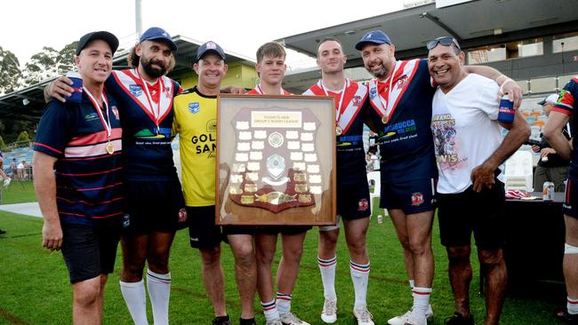 2024 Nambucca players and their fathers, who won the 1996 grand final. From left to right: Warwick Jones, Tyronne Roberts-Davis, Geoff Batten, Toby Batten, Logan Jones, Greg Davis, Brett Davis. Picture: Leigh Jensen