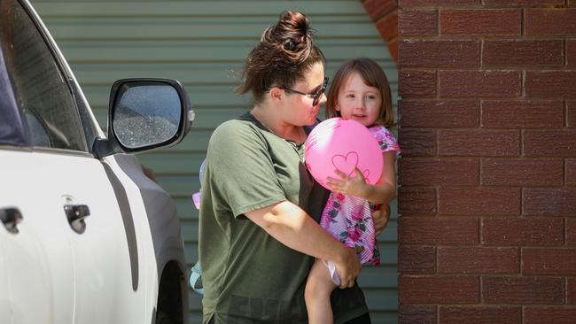 Cleo Smith is carried inside a friend's house by her mother. Picture: Getty