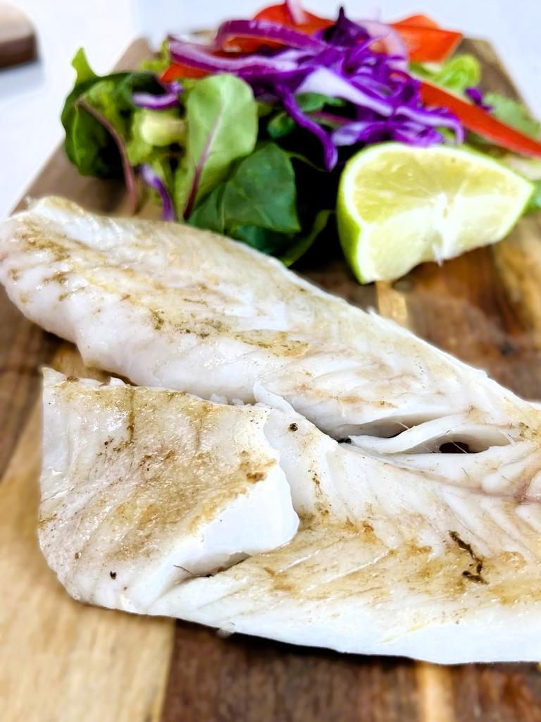 Coral trout and salad served at Wild Local seafood supplier and gourmet fish-and-chip restaurant in at 52 Herbert St, the Bruce Highway, in the Ingham CBD. Picture: Cameron Bates