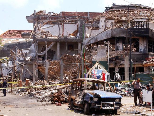 Forensic police officers at the scene of Sari Club nightclub blast in Kuta in October 2002.