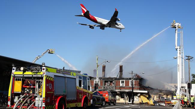 Two of the things Sydenham is know for – low flying jets and the burnt down pub. Picture: Brett Costello