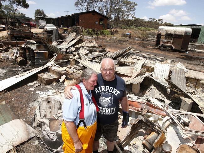 ALL GONE: Tina Mundy and Paul Voege in the ruins of their home at Hamley Bridge. Picture: Simon Cross