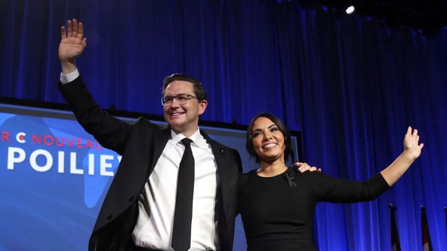 Poilievre and his wife Anaida wave to supporters during the Conservative Party Convention in Ottawa, Canada, September 2022.