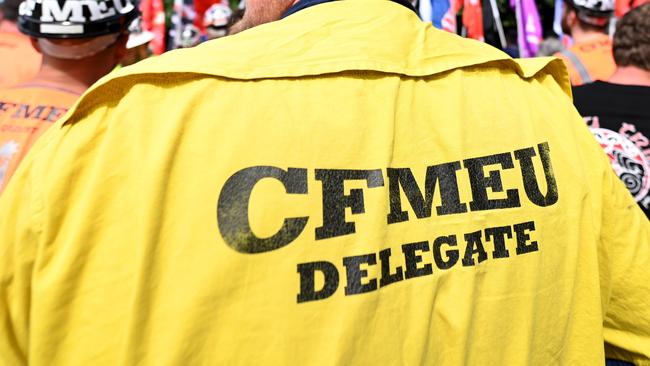 BRISBANE, AUSTRALIA - NewsWire Photos - SEPTEMBER 1, 2022.Members of the CFMEU protest outside the Queensland Government offices at no. 1 Williams Street in Brisbane. The protest coincides with the federal governmentÃs Job Summit held in Canberra today. Picture: NCA NewsWire / Dan Peled