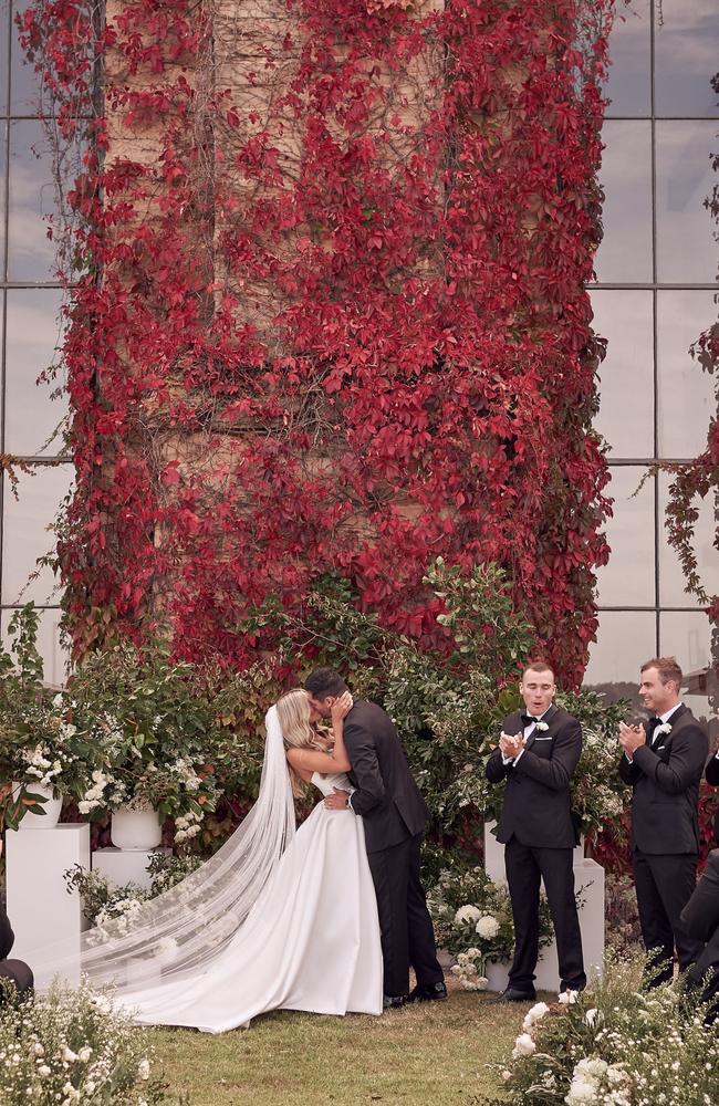 Beautiful autumn red leaves covered the Tuscan-style villa walls. Picture: Lost In Love Photography