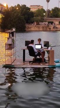 Desk on deck! Mates create floating office space